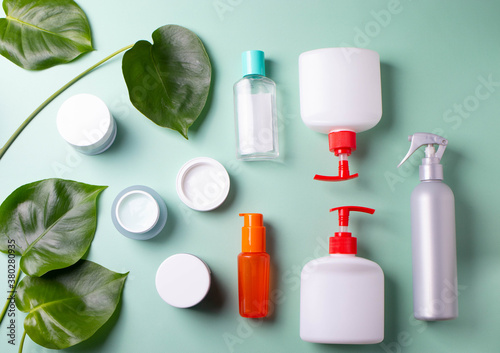 green leaves and face body care products. minimalism style