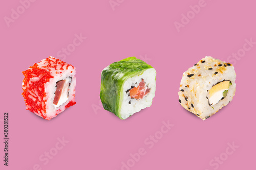 Sushi, rolls, with fillings of cheese, fish, caviar, mango. Japanese food. pink background