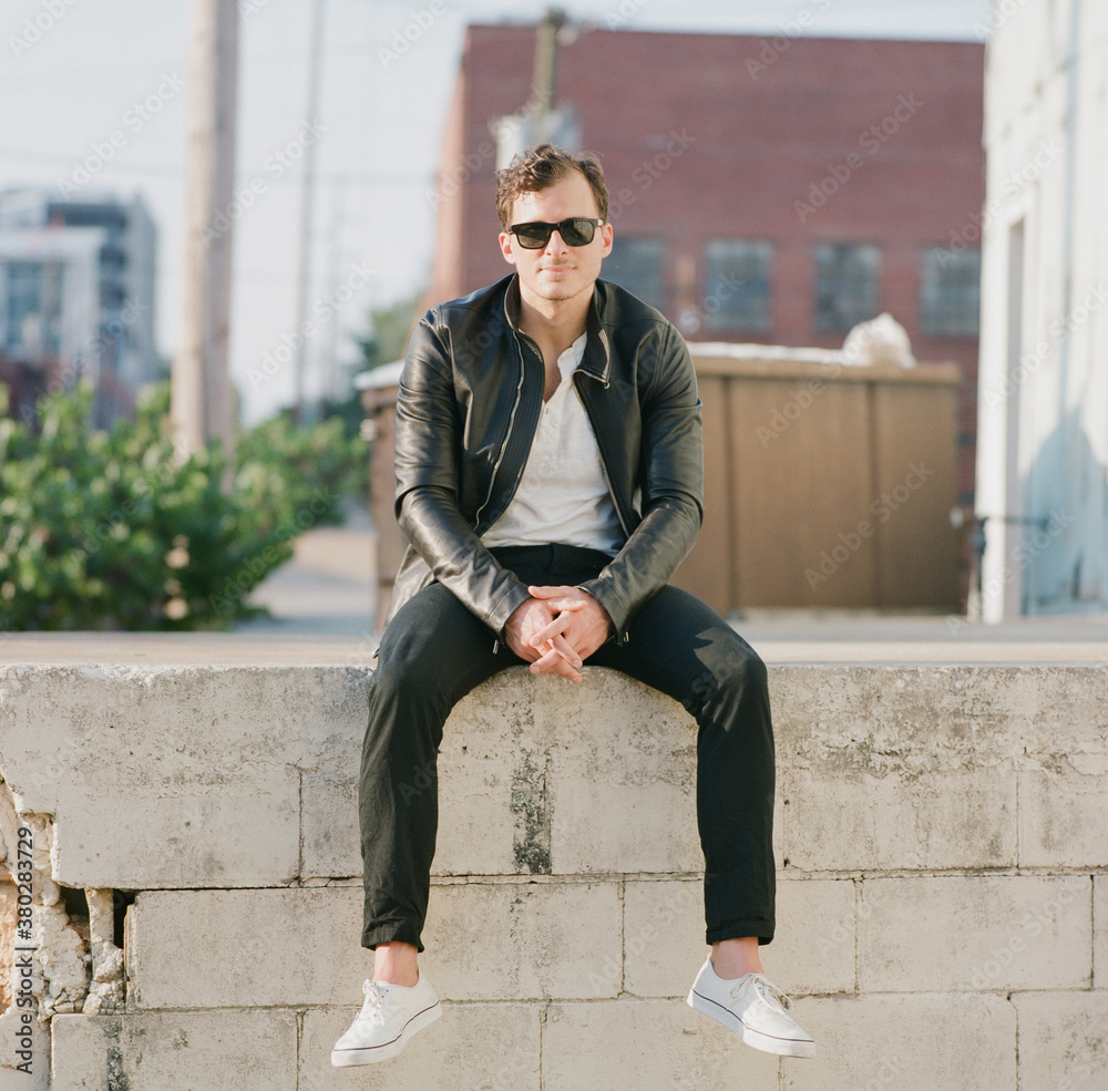 Portrait of a handsome and stylish man in an urban setting Portrait of a handsome and stylish man in an urban setting
