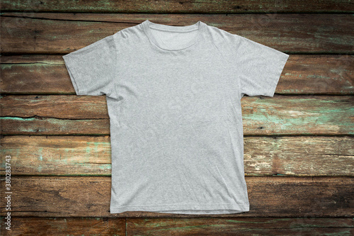 Gray t-shirt mockup on wood background template.