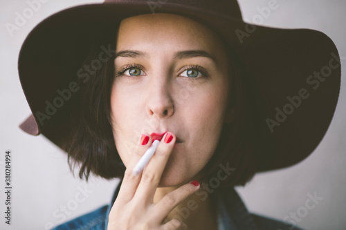 Beautiful womanl smokes photo