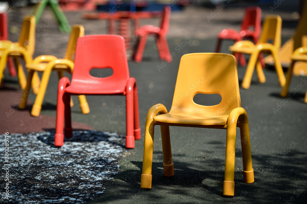 Empty chairs inside a kinder garden play zone, maintaining social distance as a measure during the COVID 19 pandemic Empty chairs inside a kinder garden play zone, maintaining social distance as a measure during the COVID 19 pandemic