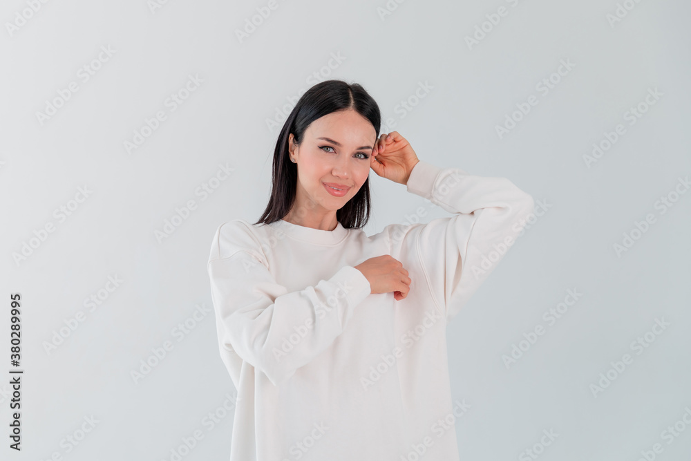 Portrait beautiful adult sports girl model on white background. hoody. logo. Portrait beautiful adult sports girl model on white background. hoody. logo.