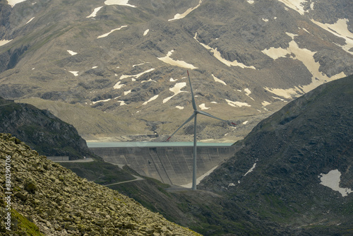 Dam and wind farm on Nufenen pass in Switzerland photo