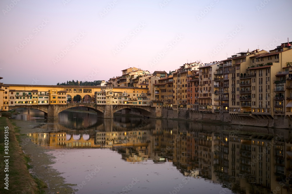 Dusk over the river Arno in Florence, Tuscany, Italy, with the Ponte Vecchio spanning the river
