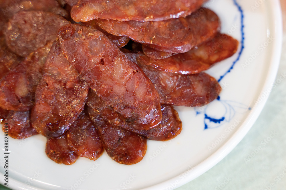 Close view of a set of sliced Sichuan sausages.