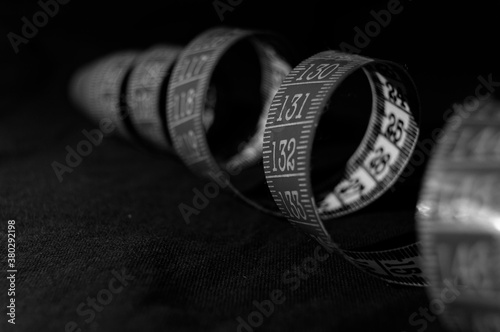 Photos Black and white tailor's meter arranged in a spiral