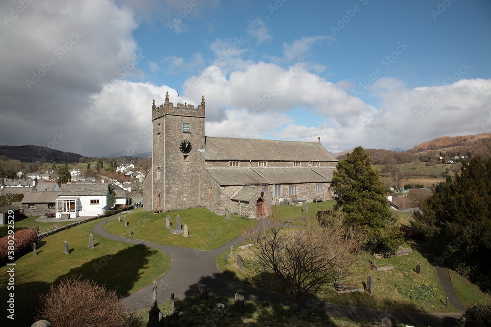 Scenic view of Hawkshead village and England National Heritage Anglican parish church during Spring in the heart of the Lake District National Park, Cumbria, England.