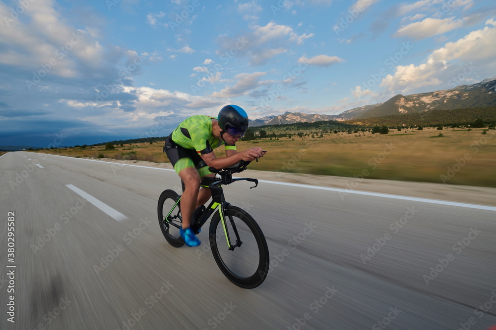 triathlon athlete riding bike triathlon athlete riding bike