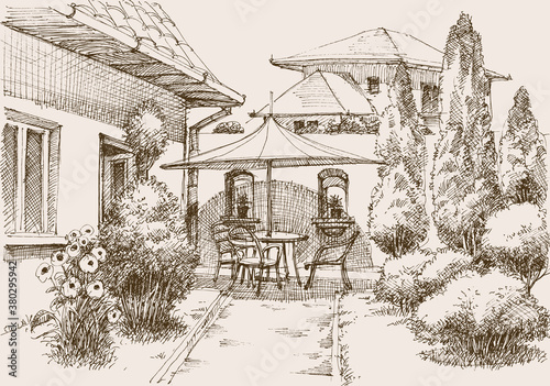 Terrace home garden, relaxing place, table, chairs and a lot of flowers