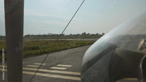 Wide shot of motor glider taking off, Pokhara, Nepal photo