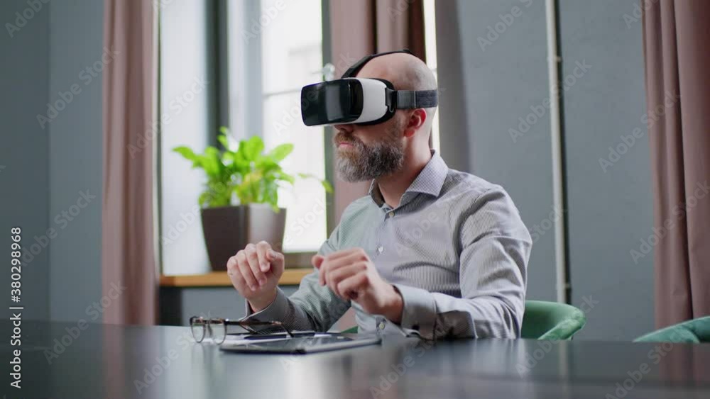 Man Sit at Office in Glasses of Virtual Reality . Man Sit at Office in Glasses of Virtual Reality .