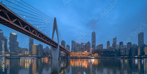 Night view of the Qiansimen bridge and the skyline in Chongqing, China. © Zimu