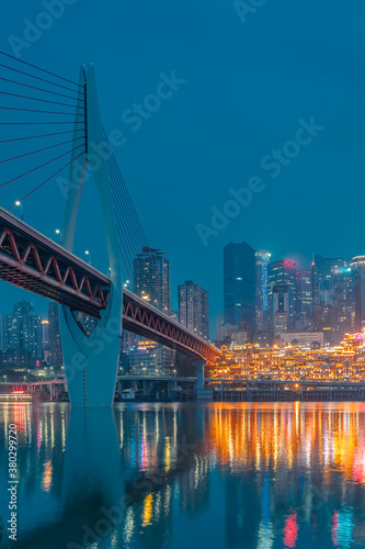 Night view of the Qiansimen bridge and the skyline in Chongqing, China. © Zimu