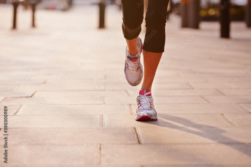 Feet Running though the city on beautiful morning Feet Running though the city on beautiful morning