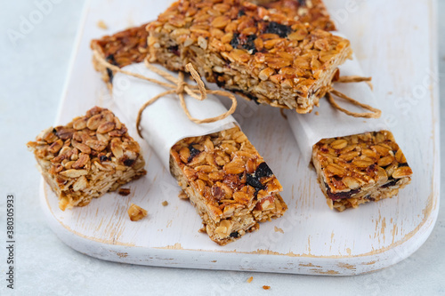 Homemade granola bars with nuts, seeds, chia seeds and dried cherries.