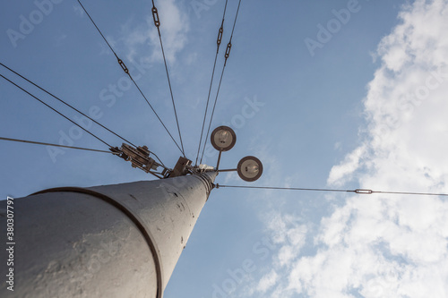 Power lines leading from lamp post