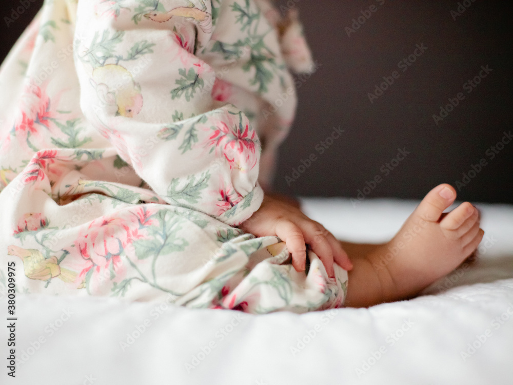 Cute baby sitting on a bed Cute baby sitting on a bed