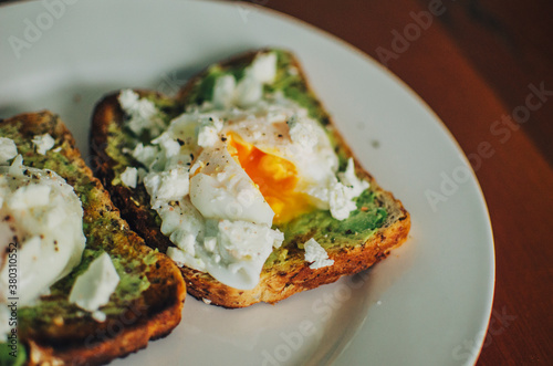 Yolk oozing out of poached egg