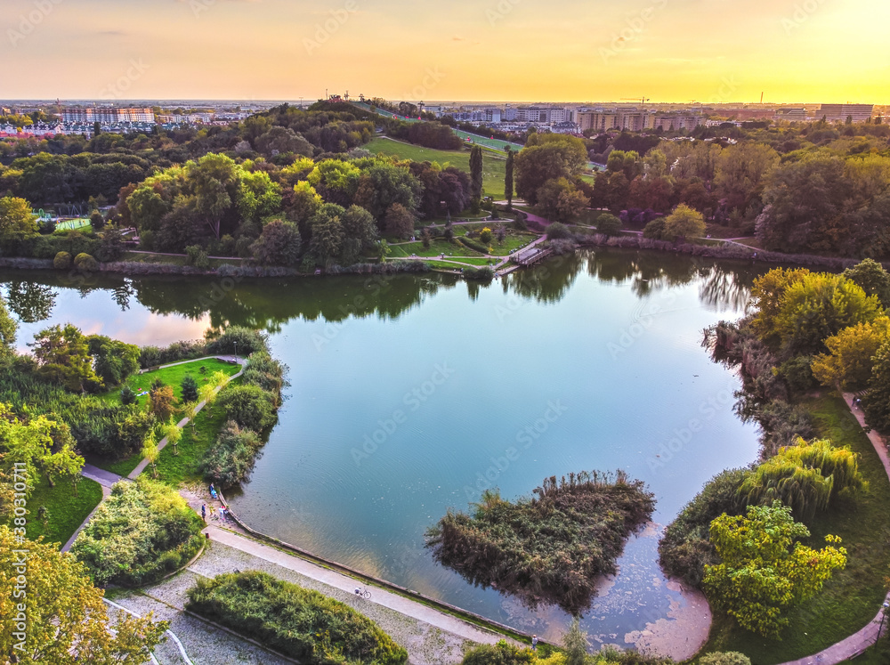 Fototapeta premium Park with large lake in the big, capital city. Drone, aerial view