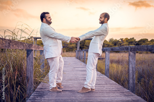 happy gay couple in the field