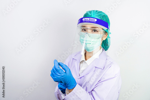 Scientist doctor wearing face mask, glasses or goggles and protective suit to fight coronavirus pandemic Covid-19, coronavirus pandemic threat quarantine, medical and healthcare concept.