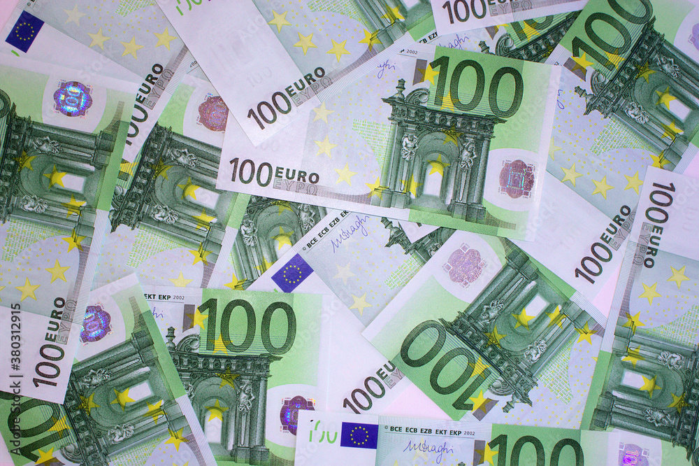 Many one hundred euros notes on the table. 100 euro banknotes Many one hundred euros notes on the table. 100 euro banknotes