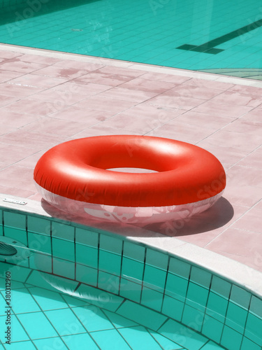 red inflatable belt at the swimming pool photo