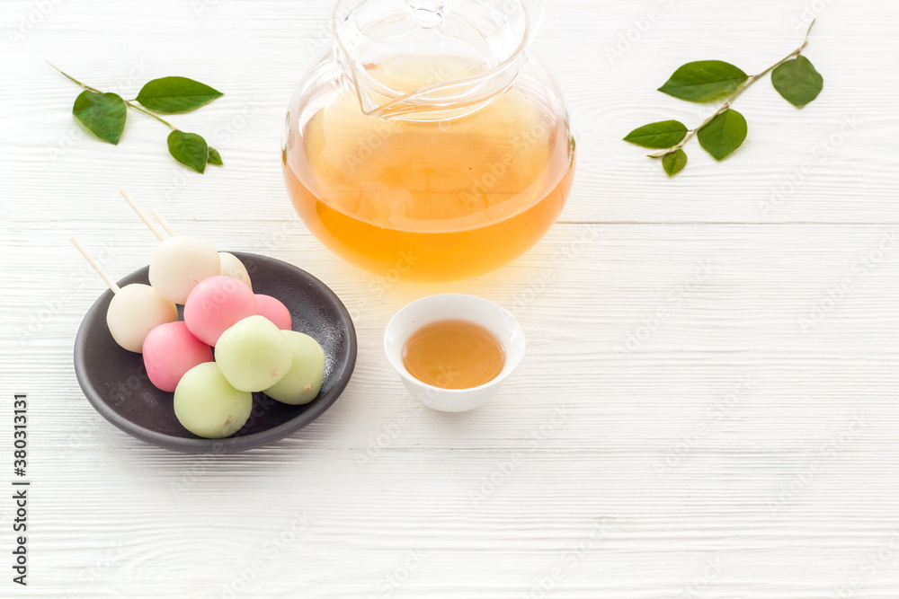 Japanese food background with sweets and tea. Three colored dumplings Dango Japanese food background with sweets and tea. Three colored dumplings Dango