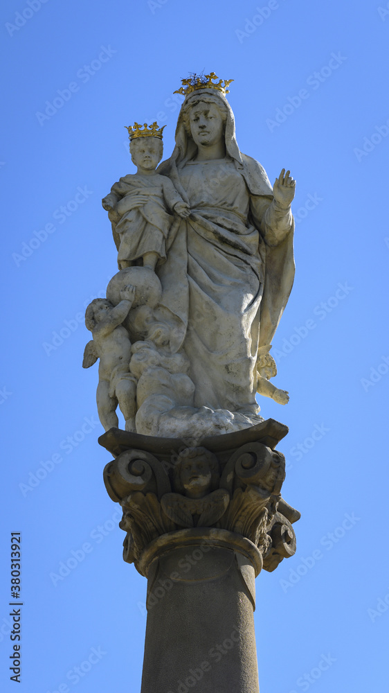 Statue of the Virgin Mary with a child with a crown on his head on a ...