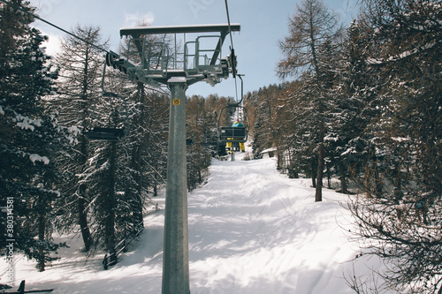 Snowboarder on the chairlift photo