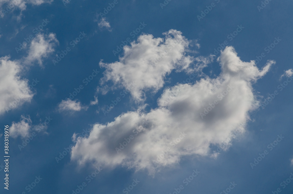 Fluffy clouds in a blue sky background and pattern Fluffy clouds in a blue sky background and pattern