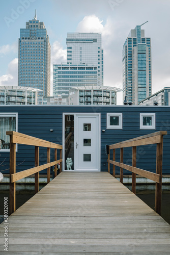 Omval architecture with houseboat and modern skyscrapers, Amster photo