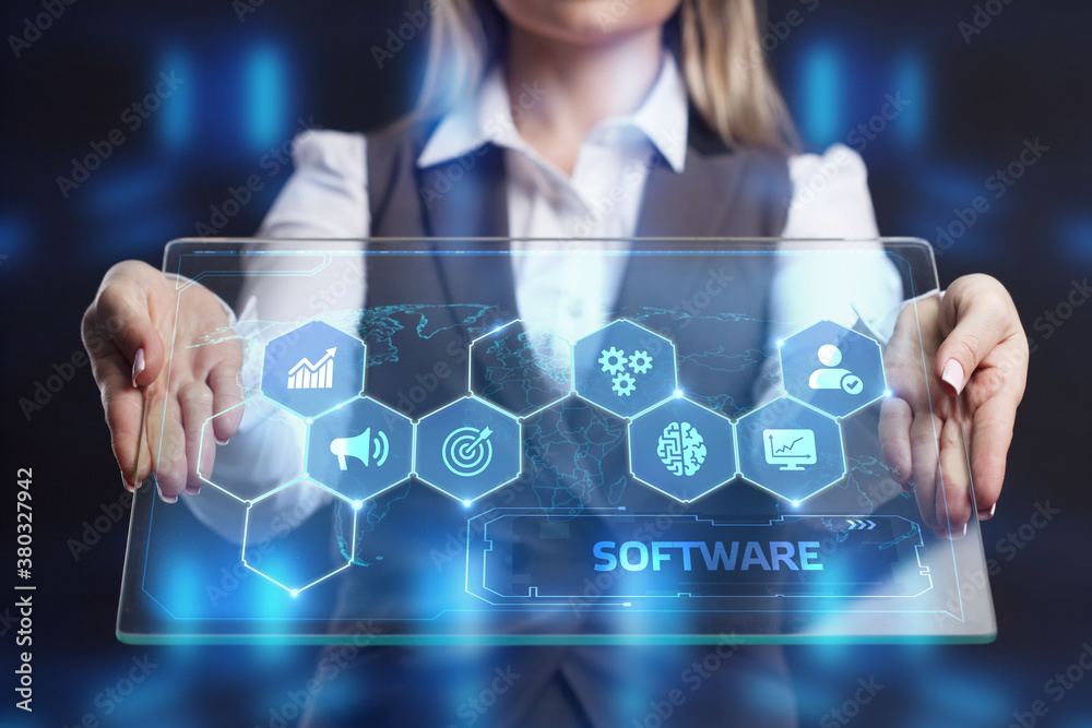 Business, Technology, Internet and network concept. Young businessman working on the tablet of the future, select the virtual screen: Software Business, Technology, Internet and network concept. Young businessman working on the tablet of the future, select the virtual screen: Software