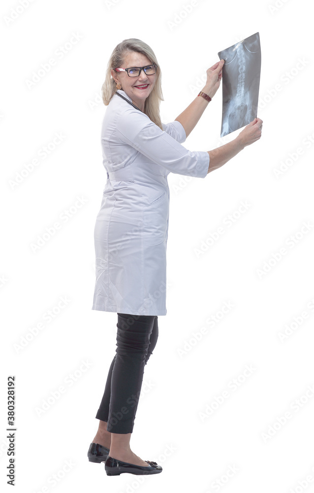 in full growth. female doctor looking at a lung x- ray in full growth. female doctor looking at a lung x- ray