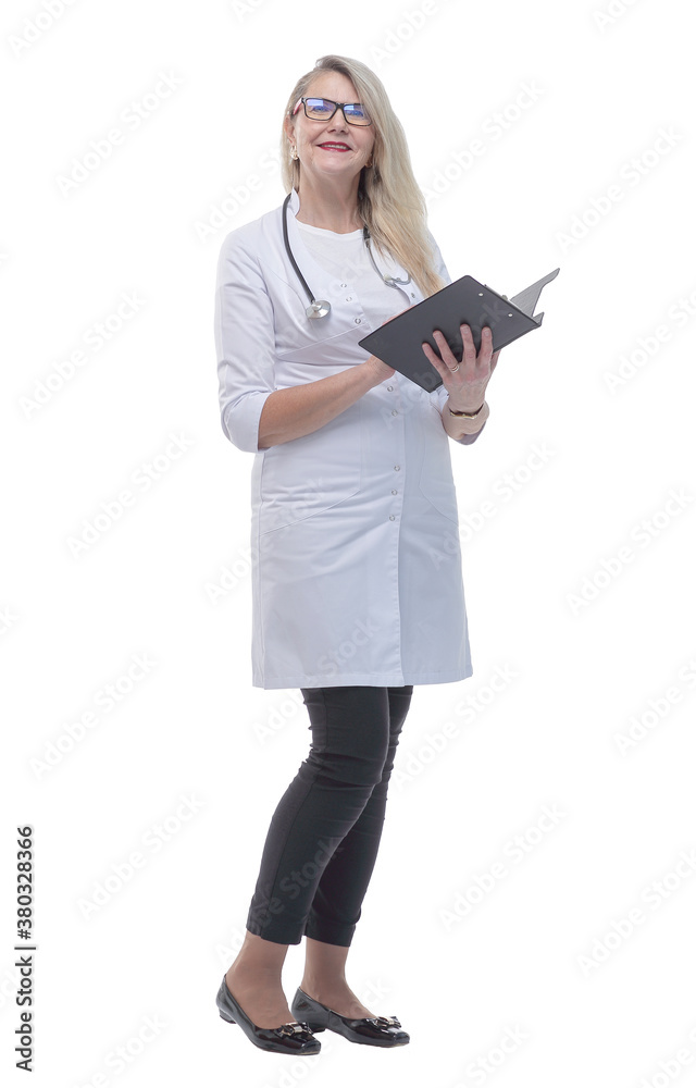 in full growth. female doctor reading medical records. in full growth. female doctor reading medical records.