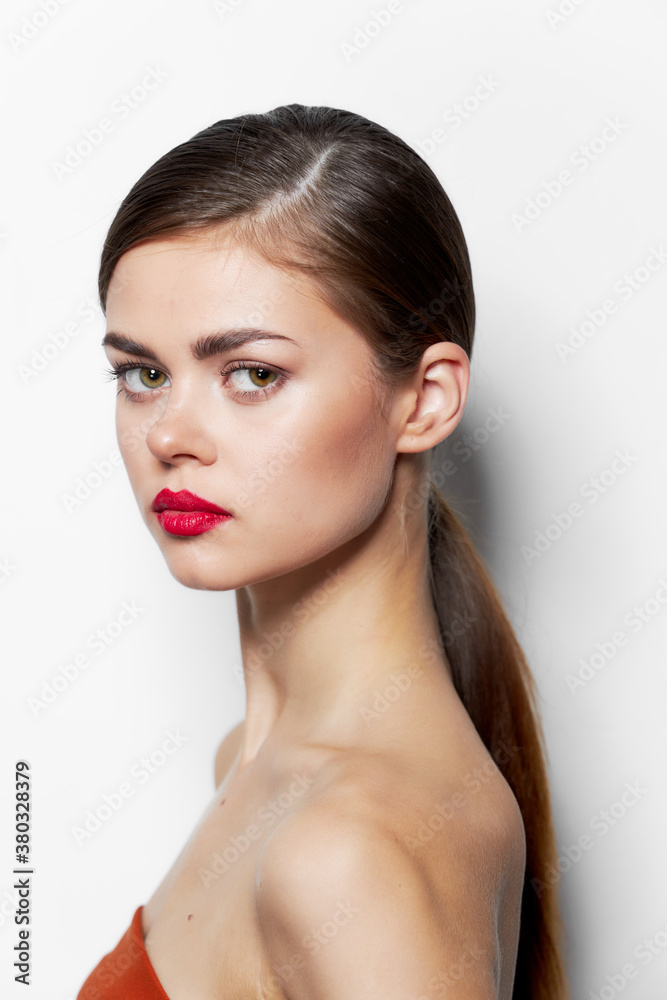 Beautiful woman stands sideways red lips attractive look Beautiful woman stands sideways red lips attractive look