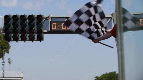 Waving checkered flag on motorsport circuit finish line real time success in competition concept