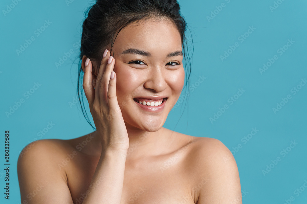 Beauty portrait of a smiling topless young asian woman Beauty portrait of a smiling topless young asian woman