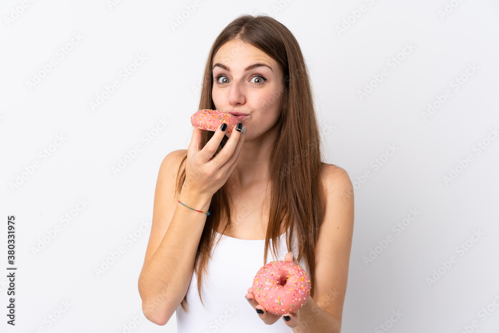 Young woman over isolated white background holding a donut Young woman over isolated white background holding a donut