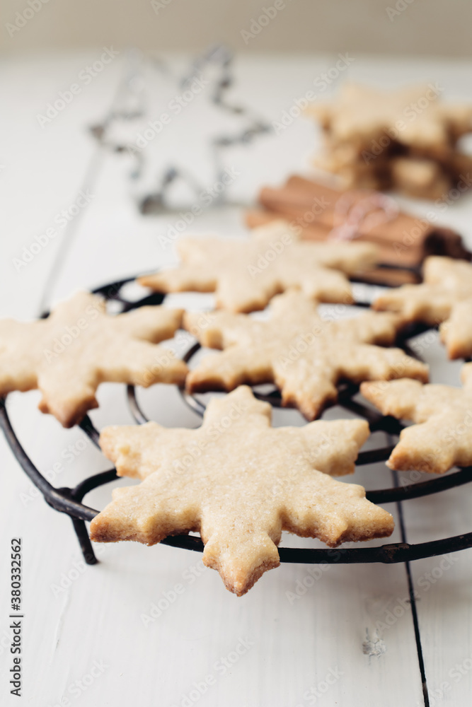 Christmas: star-shaped cookies on white table Christmas: star-shaped cookies on white table