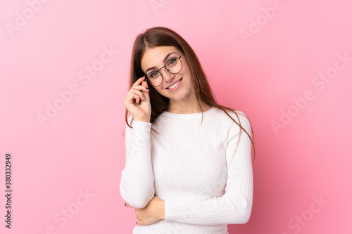 Young woman over isolated pink background