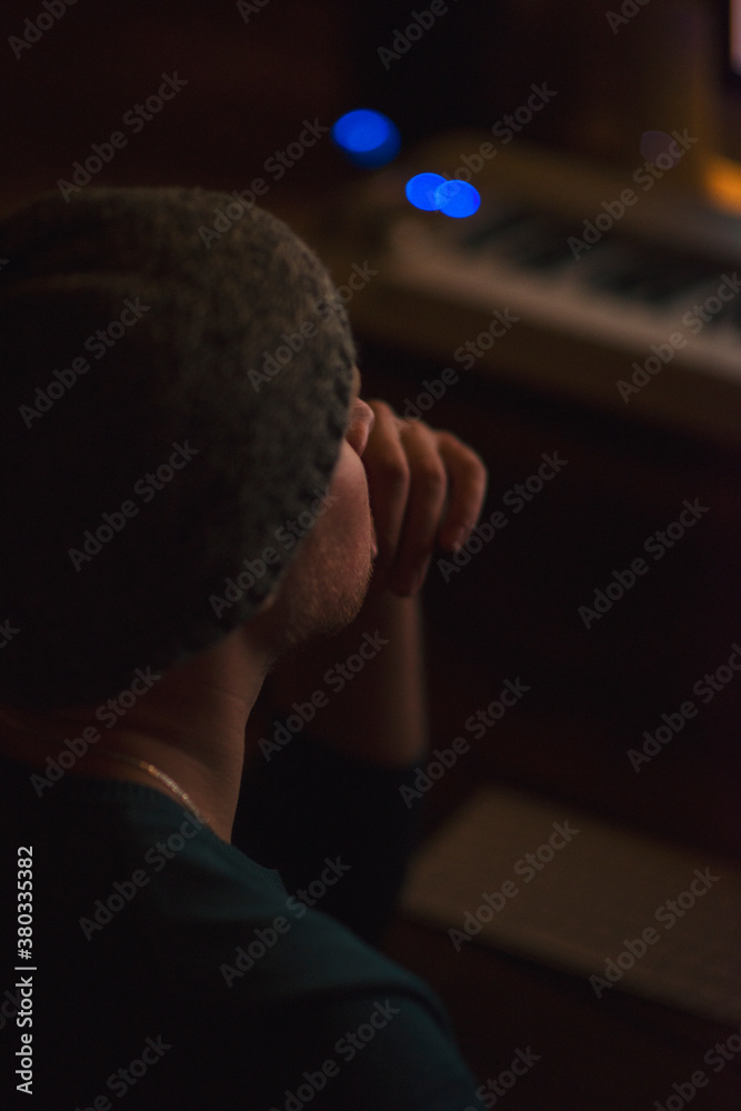 Musician writes music at studio Musician writes music at studio
