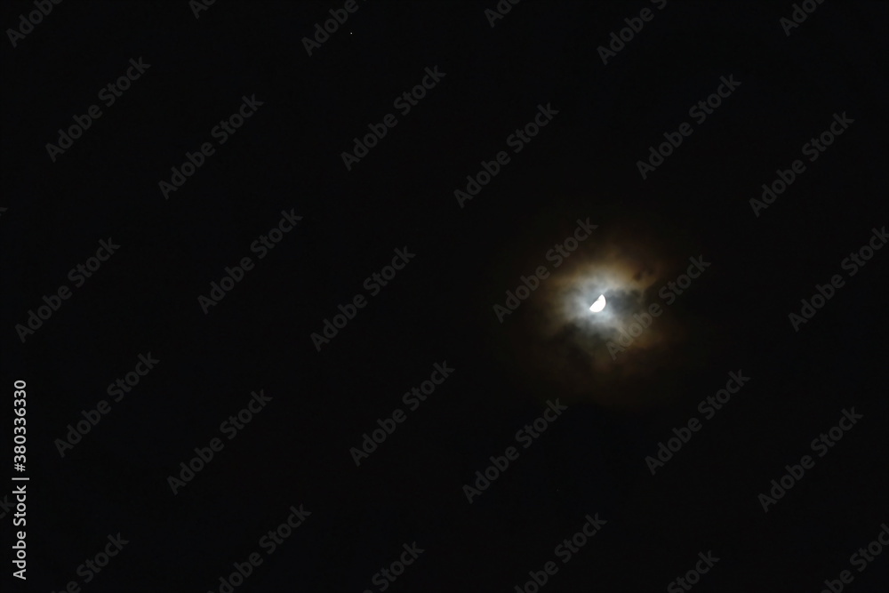half moon cover by spreading cloud in night half moon cover by spreading cloud in night