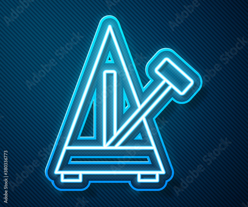 Glowing neon line Classic Metronome with pendulum in motion icon isolated on blue background. Equipment of music and beat mechanism. Vector.