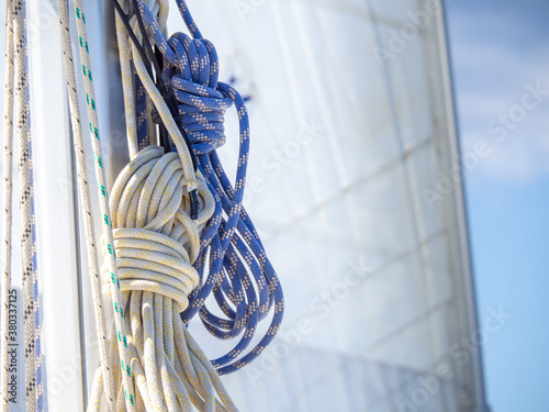 Canvas Print Sailboat equipment detail, rope tied to the mast