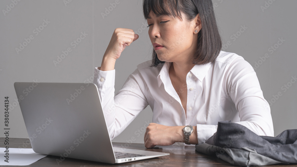 Office workers are working with high stress. At the work desk there is a labtop. Concept of working with stress Office workers are working with high stress. At the work desk there is a labtop. Concept of working with stress