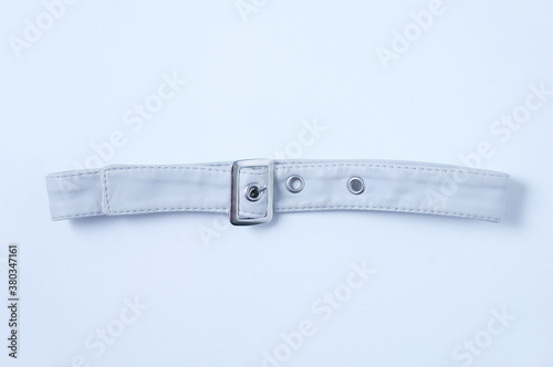Buttoned collar gray leather with metal buckle. White background.