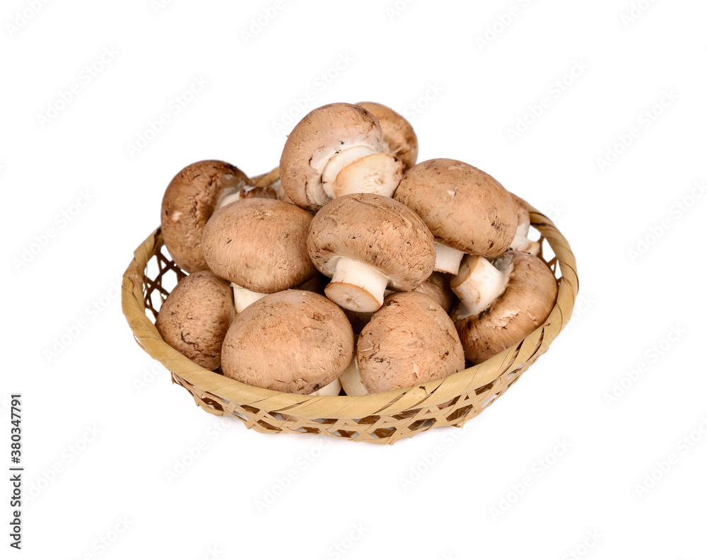 fresh champignon mushroom in bamboo basket on white background fresh champignon mushroom in bamboo basket on white background