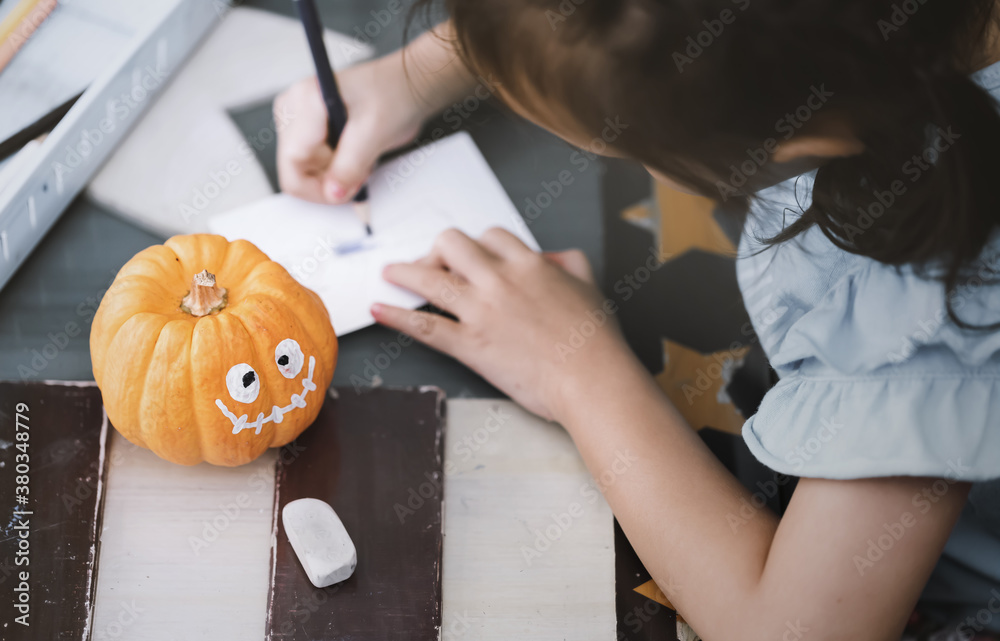 Preparation for autumn decor.Pumpkin ghost of Halloween.Halloween concept background.